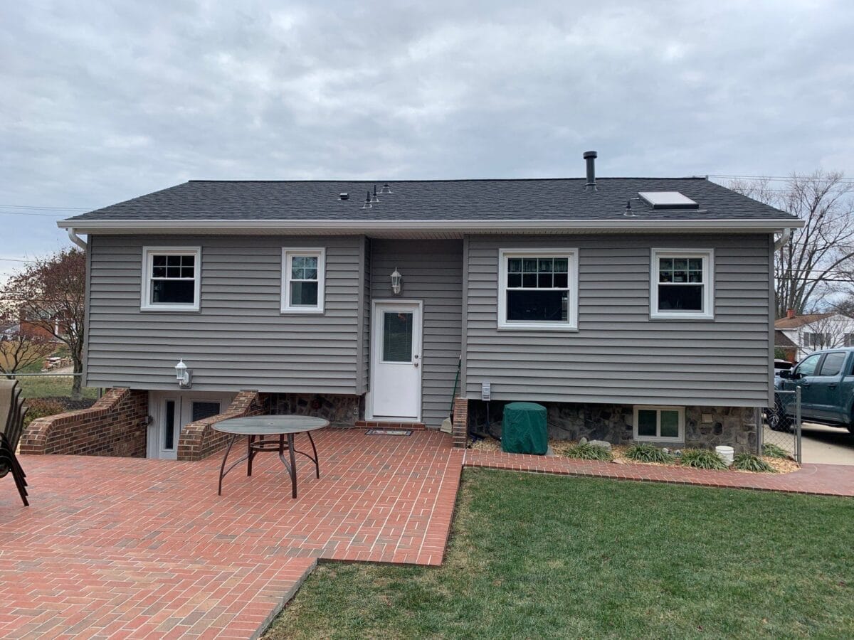 Gray home exterior with new siding installed by professional siding replacement services.