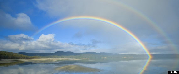 r-RAINBOW-large570 A vibrant rainbow arcs across Norfolk Bay on the Tasman Peninsula, Tasmania, Australia.