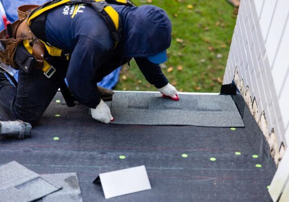 Marshall Roofing crew repairing asphalt shingles for a roofing company Manassas homeowners can trust